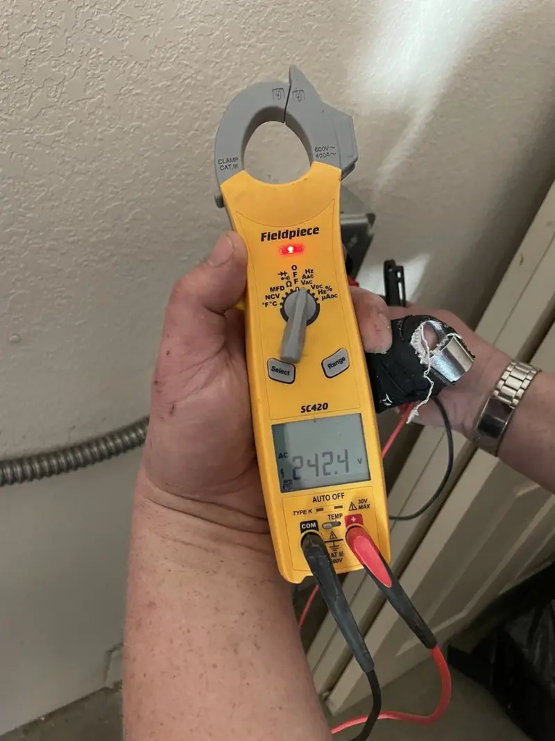 Voltage testing with clamp meter during Whole House Surge Protector in Huntingdon